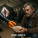 A SOMARICS soft robotic arm delivers a bowl of soup to a middle-aged man seated in a disaster relief tent.